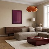 Bordeaux Glow · True Wealth. Interior photo with a 50 × 70 cm poster in a black frame.